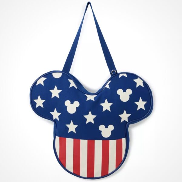 Blue Handbag Shaped Like Mickey Mouse Ears with White Stars on a Blue Background and a Red and white Striped Bottom Hanging by a Strap