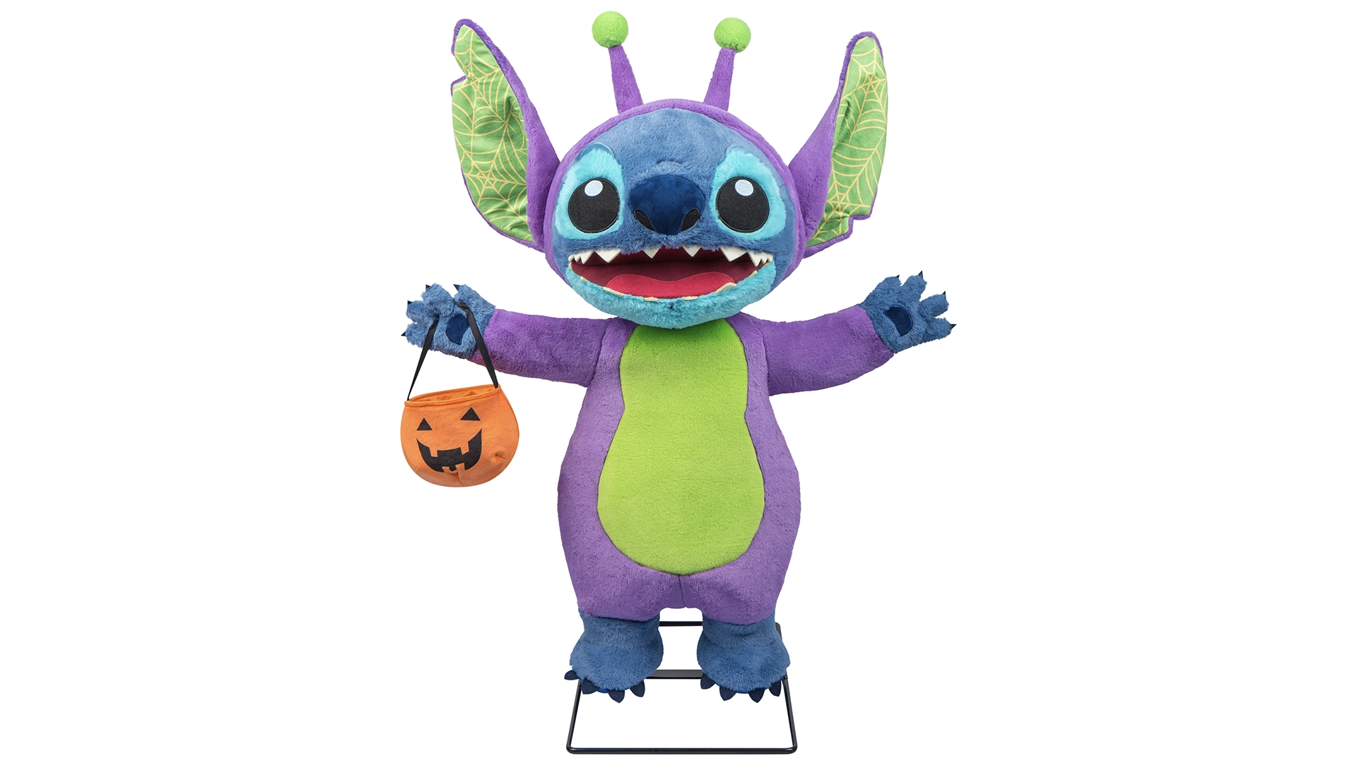Purple and Blue Plush Alien Character with a Green Belly Arms Raised Holding an Orange Jack o lantern Bucket